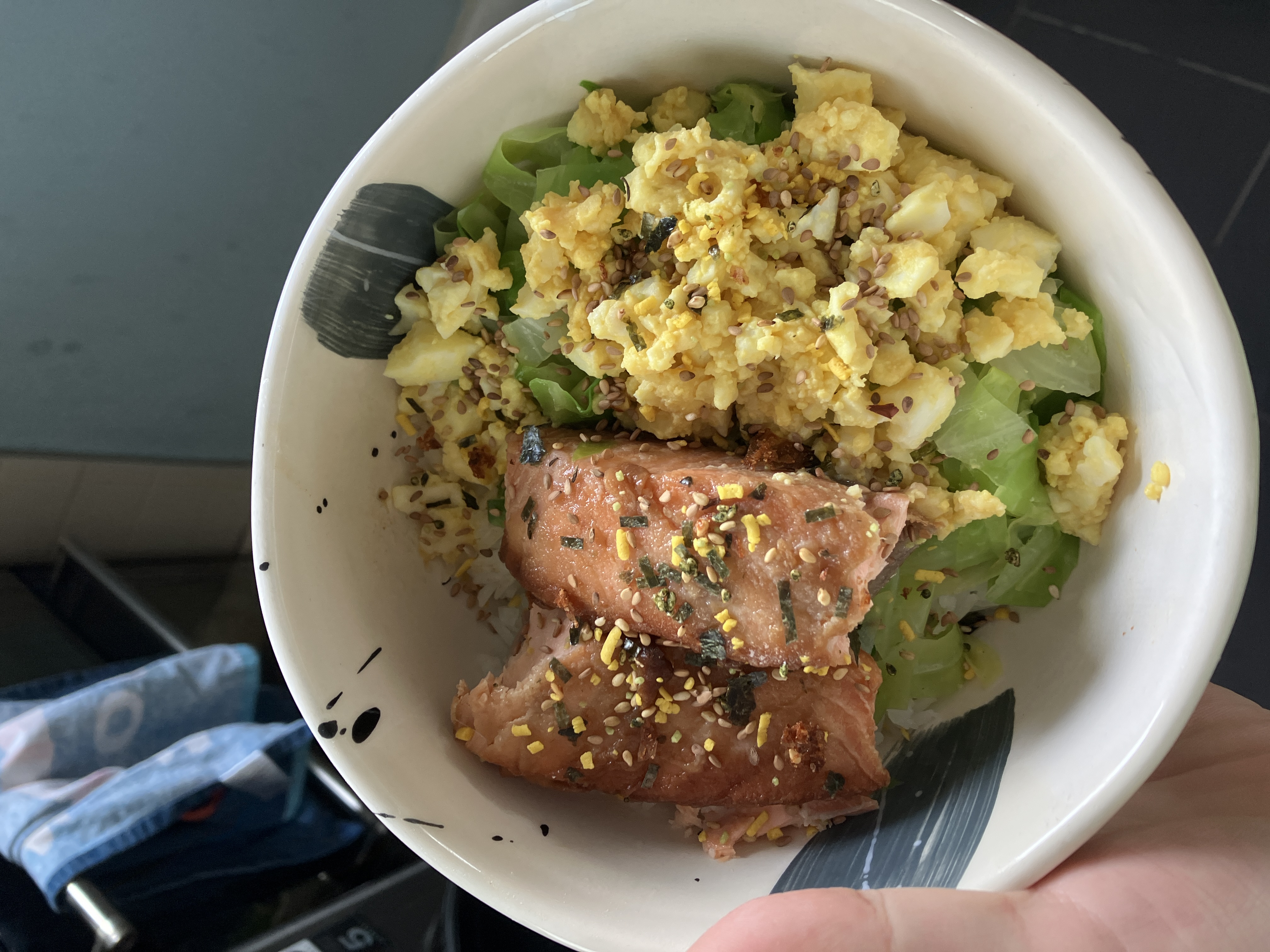 a similar rice bowl, except this time there are hard boiled egg pieces on top of the cabbage, and furikake sprinkled on top